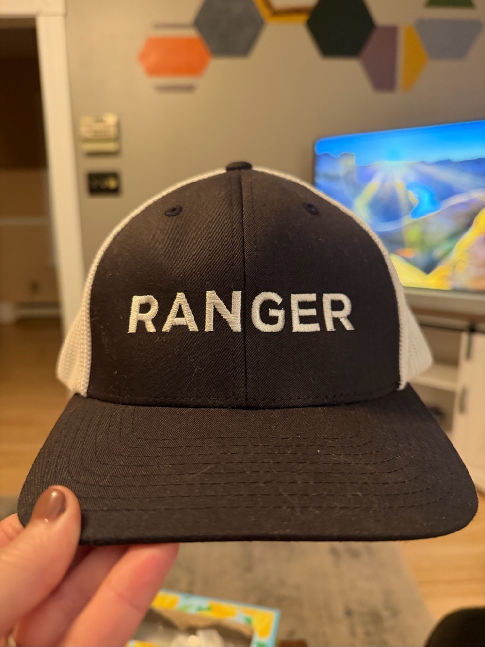 Port Authority Black and White Trucker Hat with Embroidered Logo